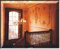 The staircase with its restored mouldings and ballustrade